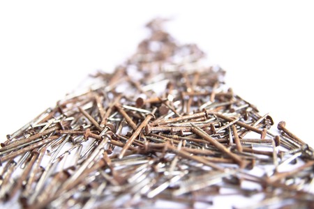 Several nails rust on a white background.の写真素材