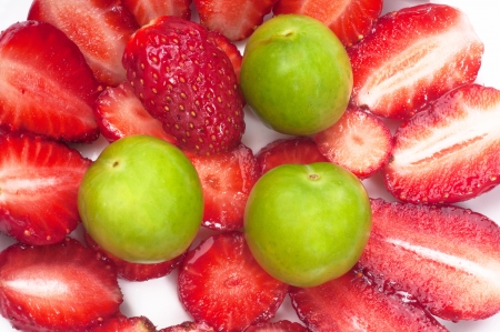 Strawberries and Plums on the Plateの写真素材