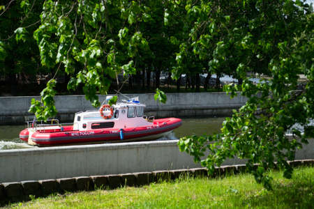 Kaliningrad / Russia, 05/16/2020: Red and white patrol boat EMERCOM of Russia, state inspection of small vessels on duty on the river in the cityのeditorial素材