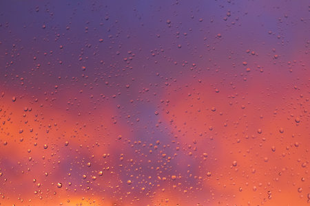 Rain water drops pattern on window glass surfaceの写真素材