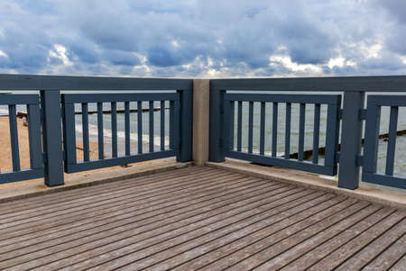 Wooden promenade for walking along the sea shoreの写真素材