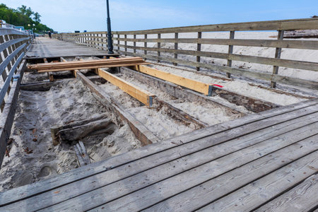 repair of a wooden promenade on a beach