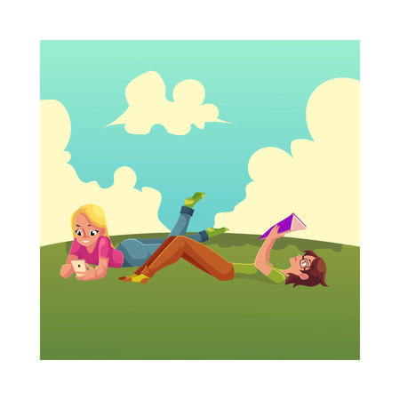 Two girls, one reading book, another playing with mobile phone, lying on the grass, cartoon vector illustration isolated on white background. Women, girls reading book and using smartphoneのイラスト素材