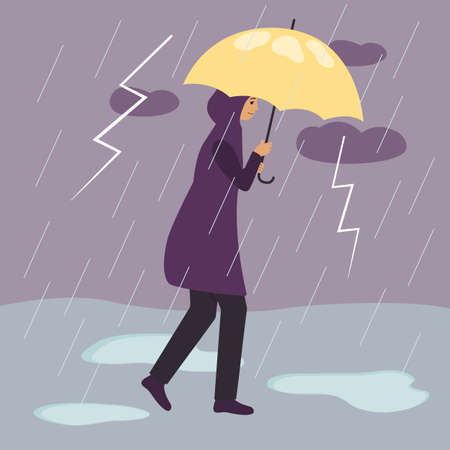A woman in a raincoat walks under a yellow umbrella during a thunderstorm and rain with lightning....
