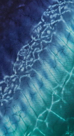 Close-up of water surface with intricate patterns and color gradients, creating a mesmerizing visual effect.の素材