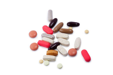 Assorted pills, vitamins and supplements on white with clipping path