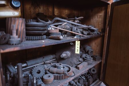 Cupboard with utensils in an old industry museum in Germany with a lot of dustの写真素材