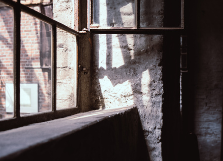 window in an old factoryの写真素材