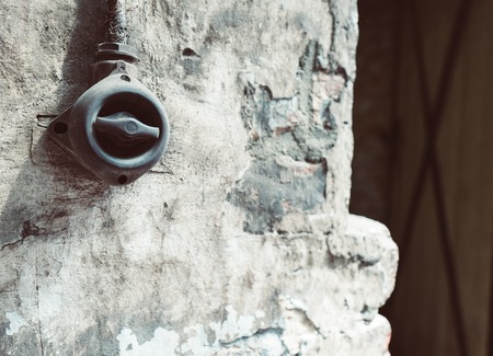 light switch on an wall in an old factoryの写真素材
