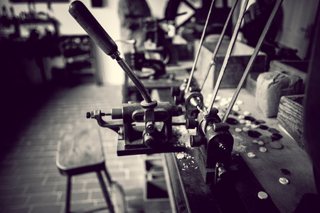 machinery and tools in old workshop in black and whiteの写真素材