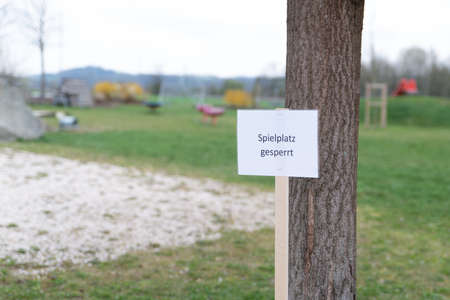 Children's playground closed due to risk of infection, blackboardの写真素材