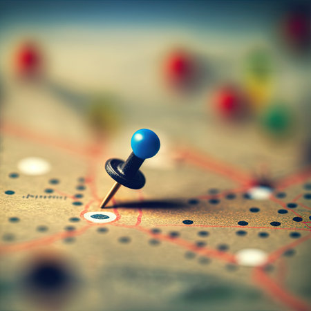 Blue and black push pin on a blurry city road map, symbol of travel planning, logistics and...
