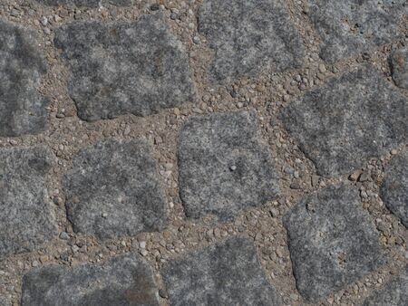 Gray cobblestones with seam of sand