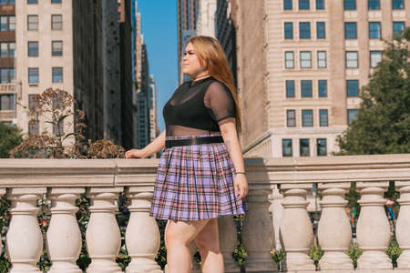 Trendy plus size woman in mini skirt