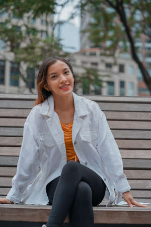 Vertical shot of a Caucasian (white) girl posing for the camera outside in United Statesの写真素材