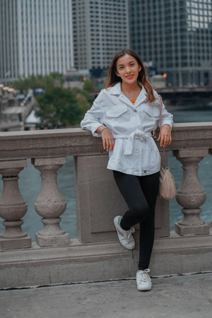 Vertical shot of a Caucasian (white) girl posing for the camera outside in United Statesの写真素材