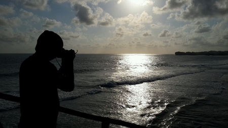 silhouette of a person against sunsetの素材