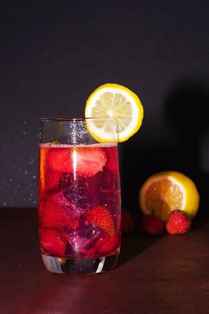 Cold summer drink. Sparkling glasses with berry cocktail.の写真素材