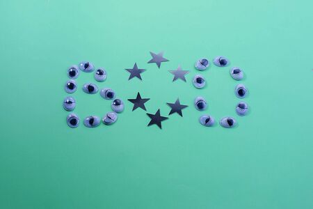 Decorative eyes on a green background. Halloween concept Trick or treat. Creative concept for halloween. Flat lay, top view, copy space.の写真素材