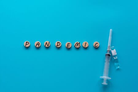 The word pandemic on a blue background.の写真素材