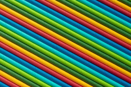 Abstract and multi-colored background of alternating stripes of red, yellow, blue, blue, green and...