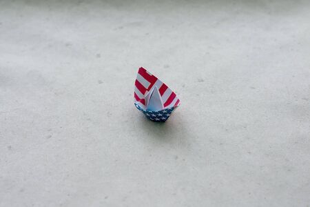 Paper boat on a neutral background. Columbus Dayの写真素材