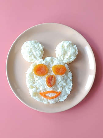 Funny food idea for kids. Plate with creative and simple breakfast for children on the tableの写真素材