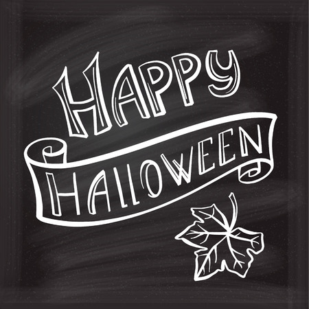 Happy Halloween hand lettering on a chalkboard background.のイラスト素材