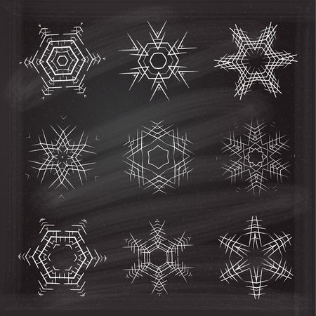 Vectot ornamental snowflakes set on chalkboard background.のイラスト素材