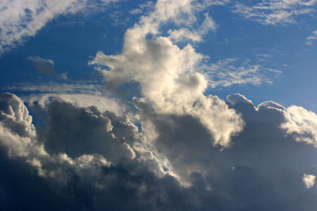 Cloud and sunlight contrasts sunbeam and dark clouds