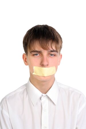 sad teenager with mouth sealed の写真素材