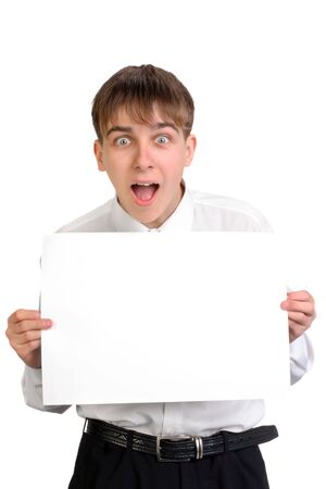 amazed teenager holding blank paperの写真素材