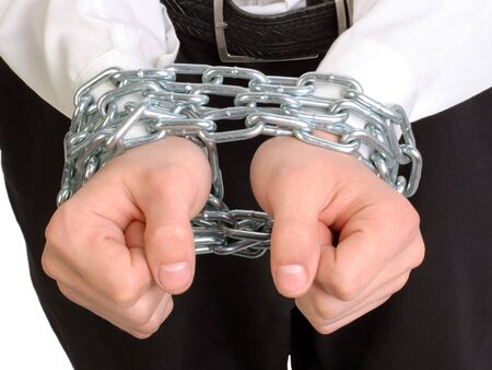 hands tied chains close upの写真素材