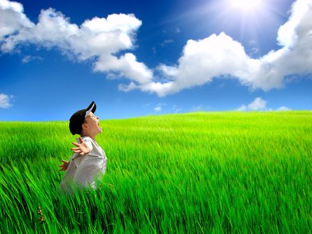 The happy child on a summer fieldの写真素材