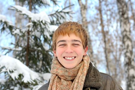 happy teenager in winter forestの写真素材