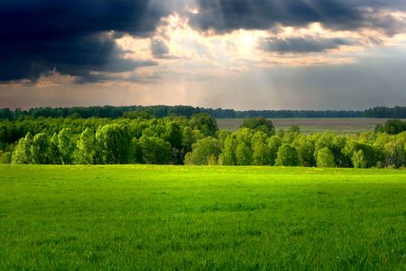 Dramatic cloudscape over village landscapeの写真素材