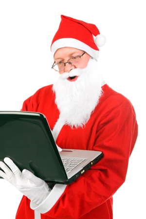 santa claus with notebook isolated on the whiteの写真素材