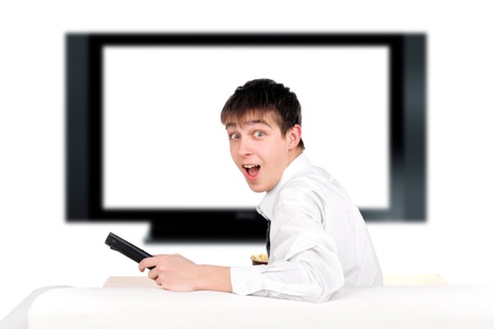 amazed teenager sitting on the sofa and watching tv-set
