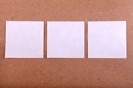 Notice Board with empty papers on old wooden wall background