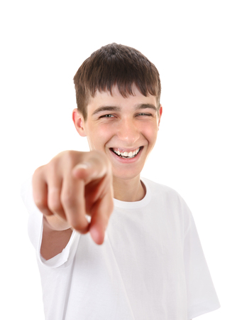 Cheerful Teenager Pointing at You. Isolated On The White Backgroundの写真素材