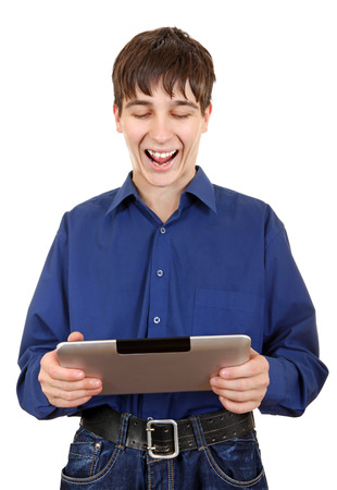 Happy Teenager with Tablet Computer Laughing on the White の写真素材