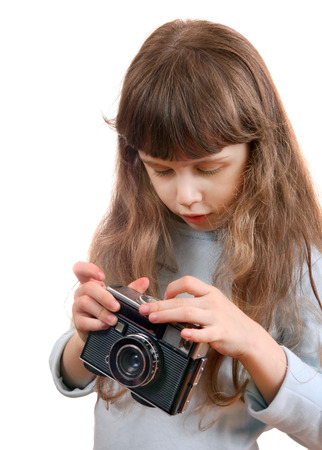 Little Girl with Retro Photo Camera Isolated on the White Backgroundの写真素材
