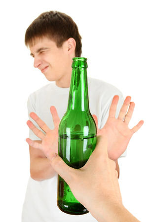 Teenager refuse a Bottle of the Beer on the White Backgroundの写真素材