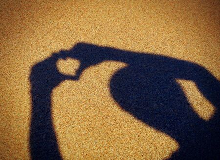 Vignetting Photo of Heart Shape Shadow on the Summer Beach