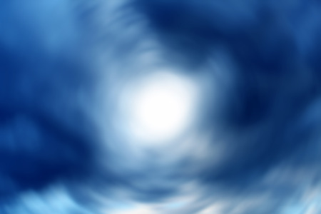 Blurred Abstract Background of Natural Dramatic Clouds with White Spot in the middle