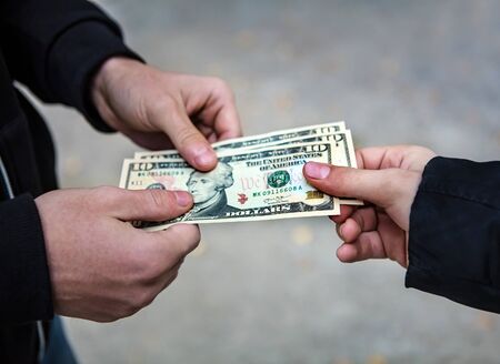 Person take the Money on the Street closeupの写真素材