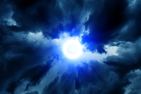 Blue Light in the Dark and Dramatic Storm Clouds