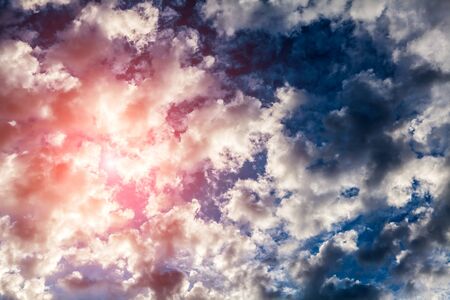 Red Sunlight in the Dark and Dramatic Storm Cloudsの写真素材