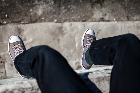 Person in the Sneakers on the Roof Of Buildingの写真素材