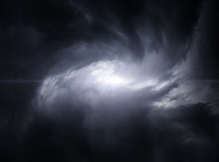 Blurred Swirl in the Dark Storm Clouds with Ray of the Light